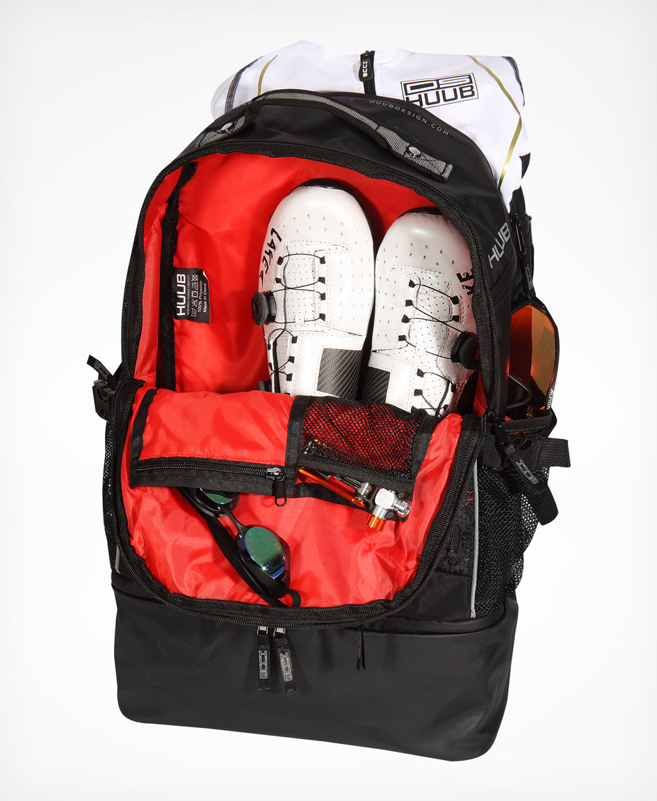 HUUB TT Bag – Transition Three, 40L rucksack, wet/dry, hidden helmet cradle, navy and olive/orange.